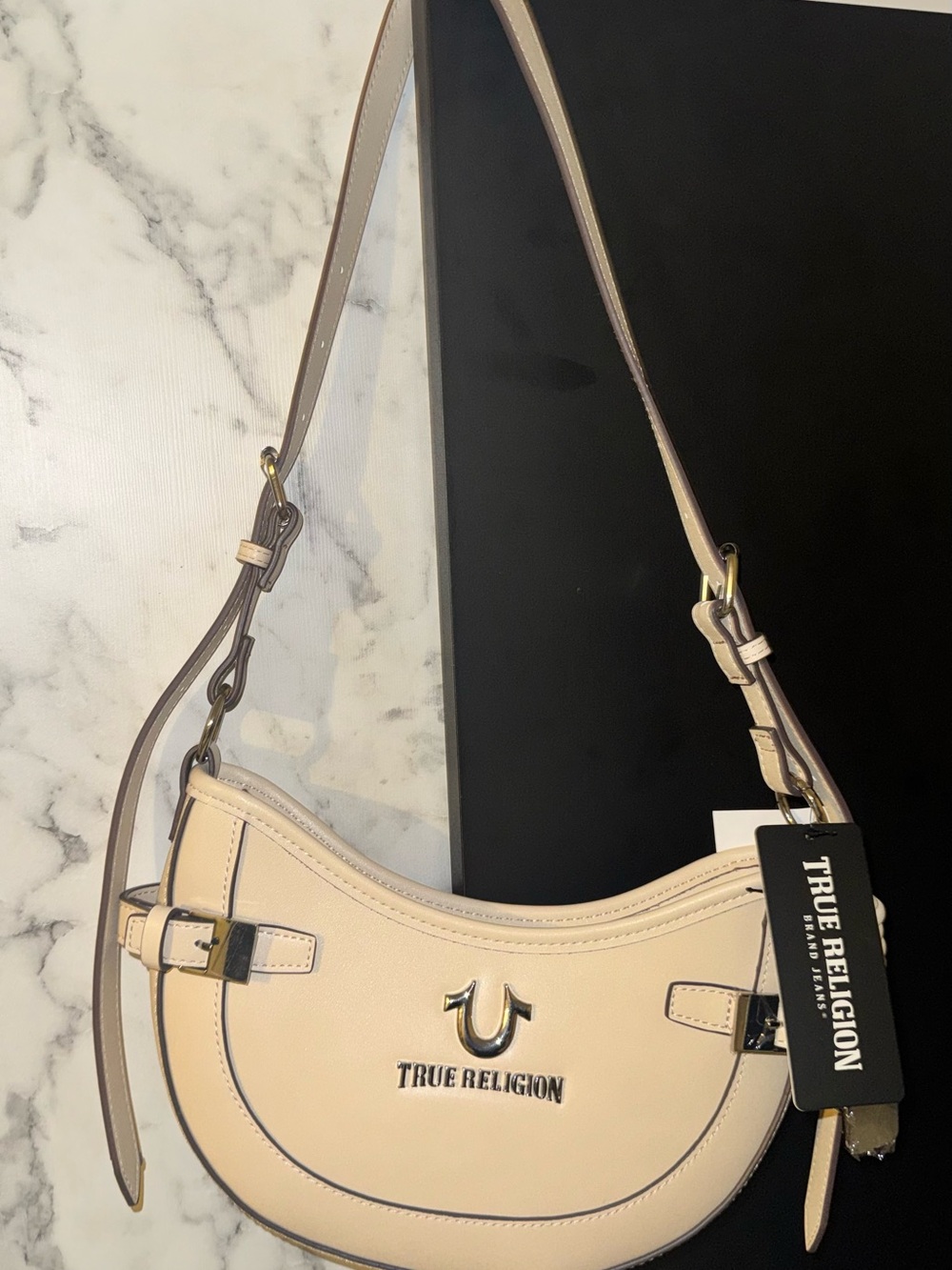 True Religion Cream Crescent Shoulder Bag with Silver Hardware